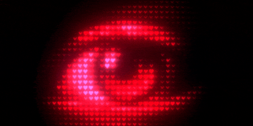Animated eye made of glowing heart tiles