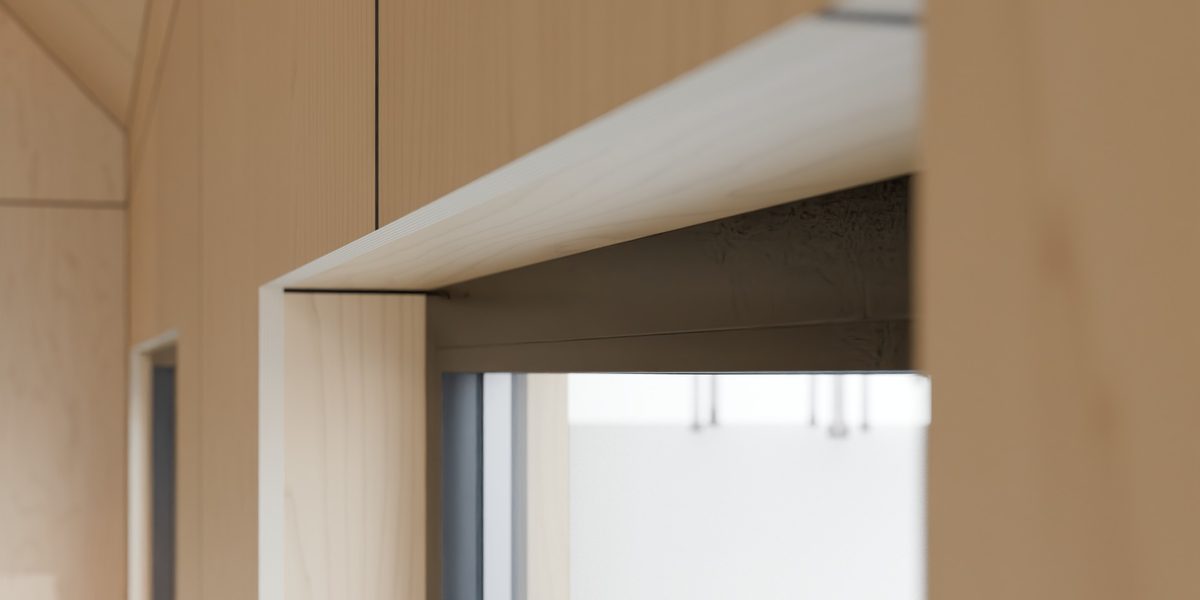 Plywood end grain at a window reveal
