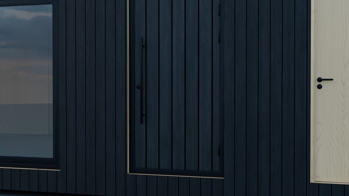 Entrance door clad in charred boards with a bar pull