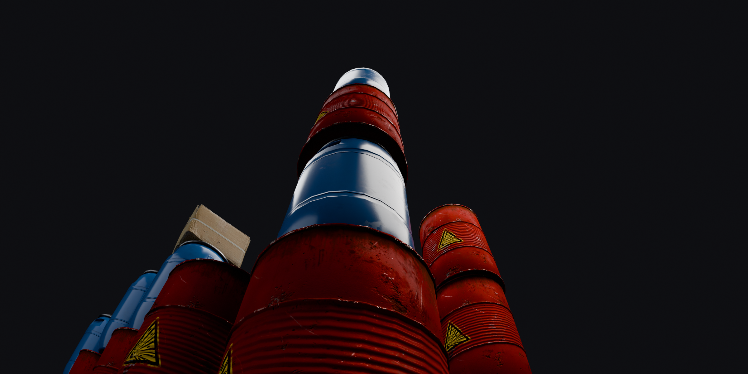 Low angle wide shot looking up three towers of oil drums
