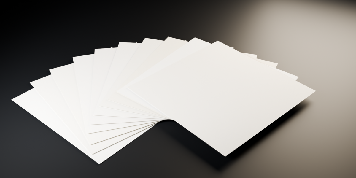 Ten cold-pressed cotton rag and watercolour sheets fanned out on a dark surface