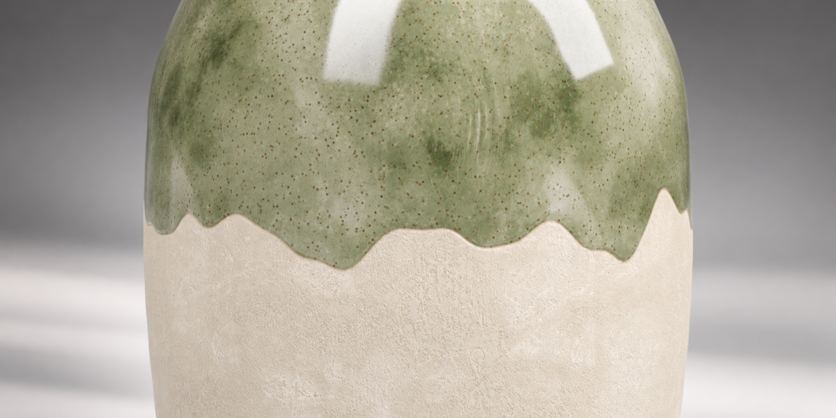 Close-up of glossy green glaze and tactile cream ceramic body