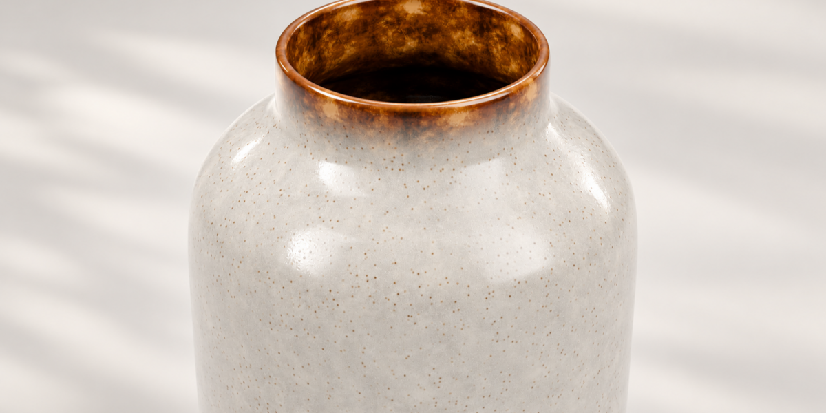 Amber glazed neck and shoulder of the shorter ceramic vase
