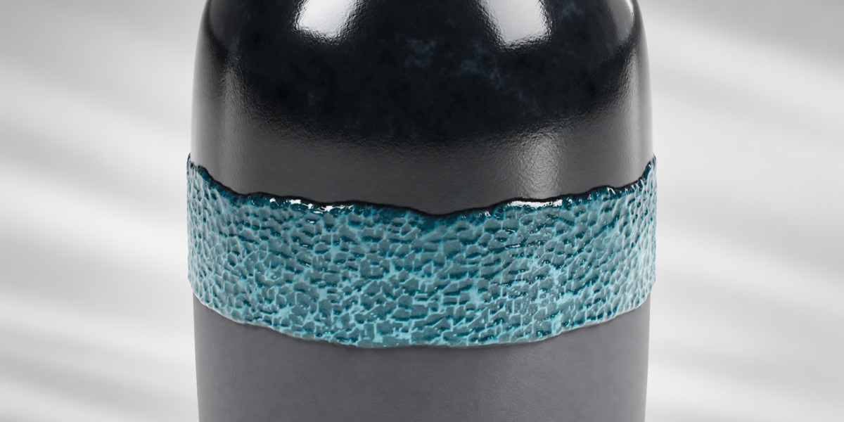 Detail of turquoise trim meeting dark and gray ceramic surfaces