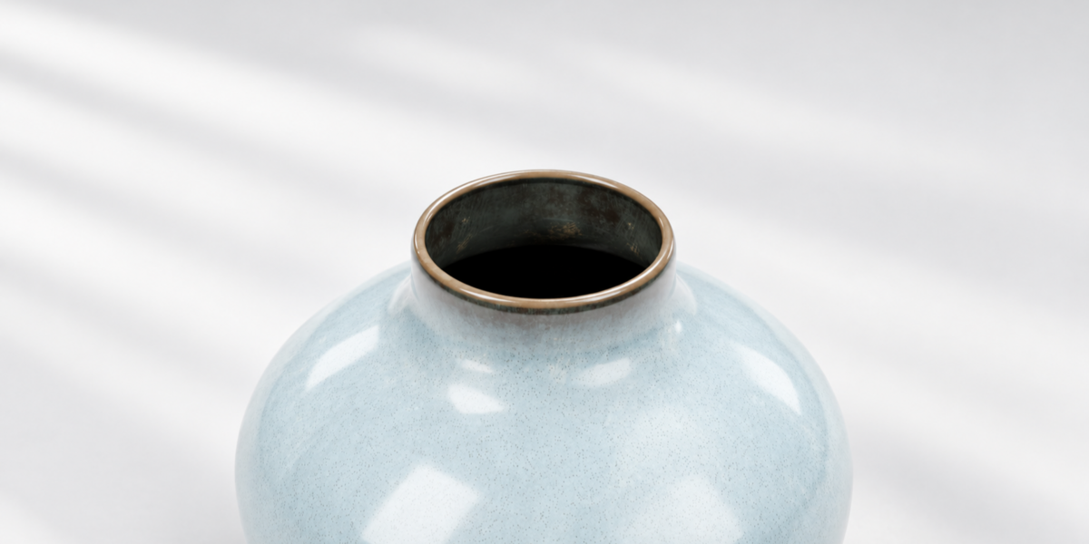 Close-up of the vase opening and dark-rimmed pale-blue glaze